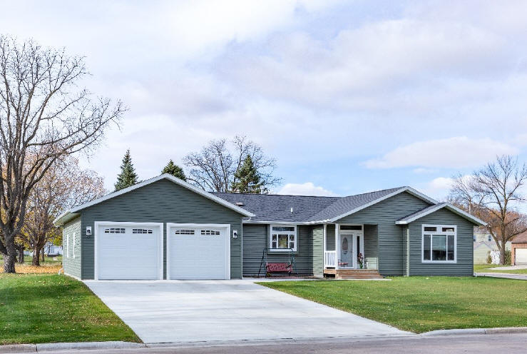 A manufactured home with a two car garage