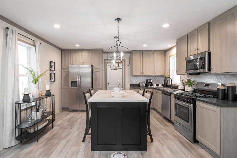 An upscale, modern kitchen shown in the interior of a manufactured home. Despite some popular misconceptions, manufactured homes can be luxurious and comfortable.