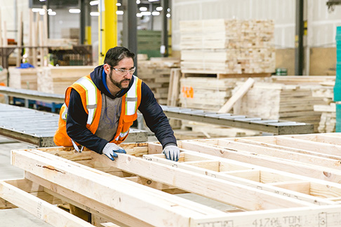 A worker assembles a manufactured home in a manufacturing facility. Modular and manufactured homes are cost-effective alternatives to stick-built homes.