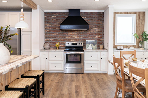 The modern, esthetically pleasing, customized kitchen of a modular home.