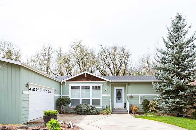 The front entrance of a manufactured home is pictured. Properties like these can benefit from adding accessory dwelling unit (ADU) housing to their location.