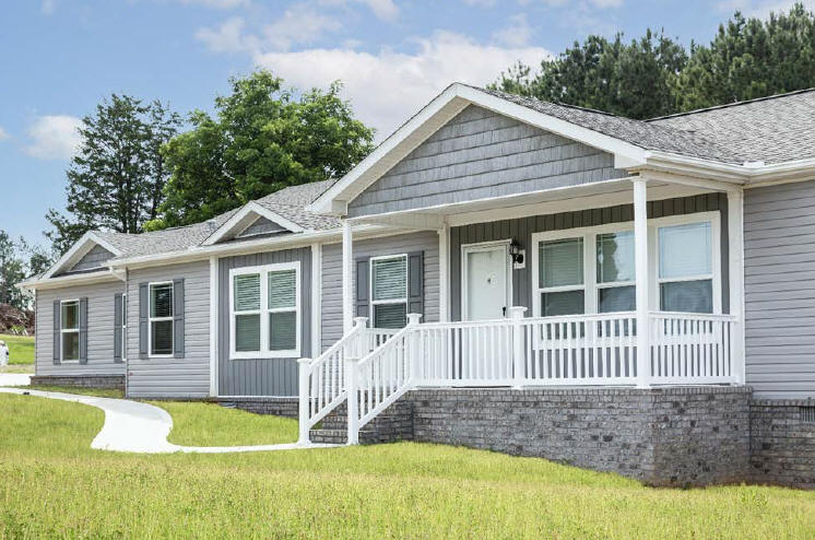 A manufactured home with a front porch