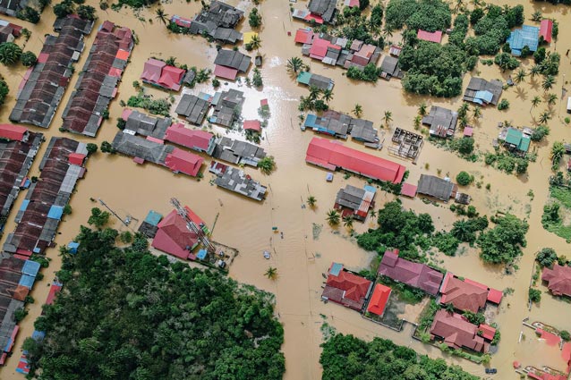Homes and businesses remain underwater following a devastating flood that brought waters up to the level of their red shingle roofs.
